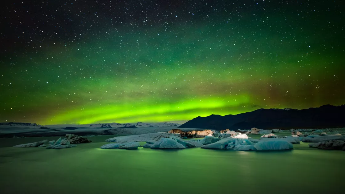 Aurora borealis over a glacial lake in Iceland