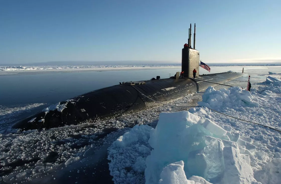 The Los Angeles-class attack submarine USS Hampton (SSN 767) surfaces on March 2014 at the North Pole for an operational exercise beneath the polar ice cap. Scientists traveling aboard collected data and performed experiments. Credit: U.S. Navy/Kevin Elliott.