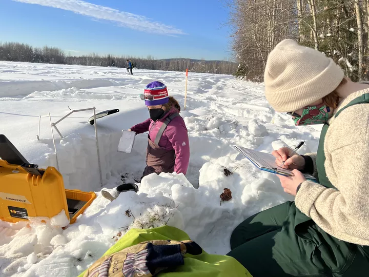 Jesslyn Di Fiori and Devon Dunmire record snow density measurements at Creamer’s Field