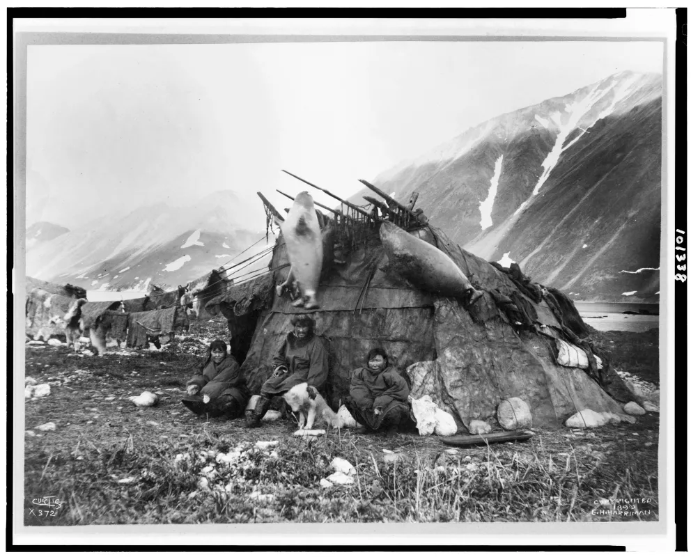 Inuit hut and family