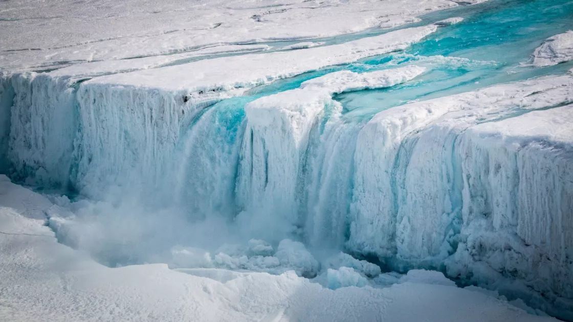 Waterfall of meltwater from Nansen Ice Shelf.