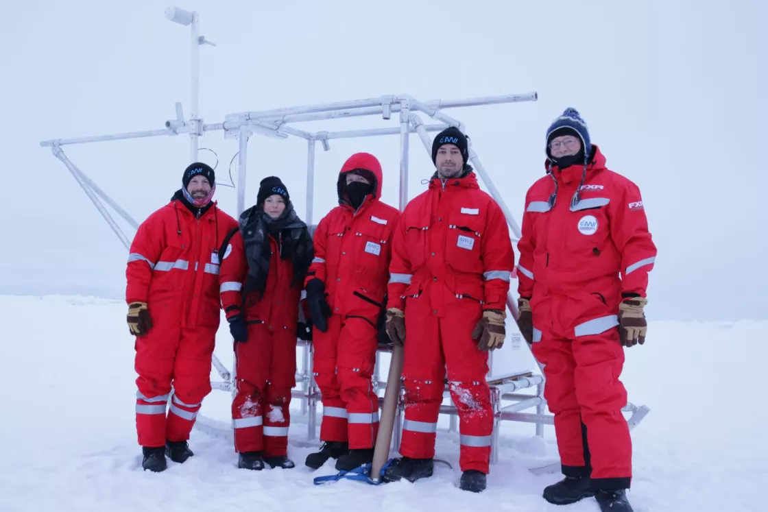 Scientists and students pause for a quick photo while setting up the meteorological station on the sea ice. From left to right: Sean Horvath, Julika Zinke, Anne Gold, Neil Aellen, and Ola Persson. 