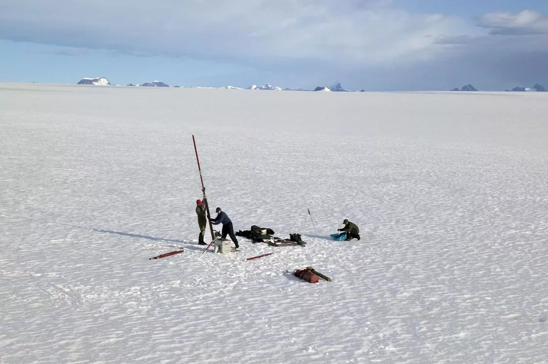 drilling a long hole to extract ice core samples
