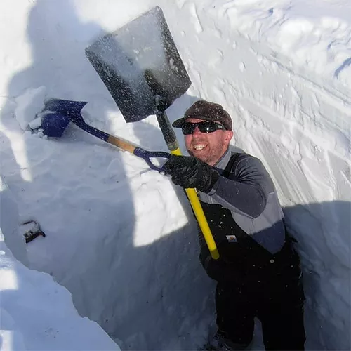 Drew Slater in snow pit
