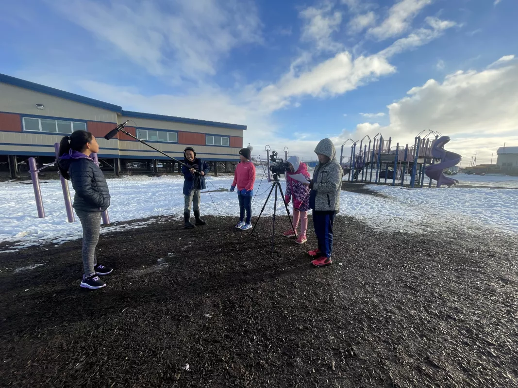 Students film outside of school and playground