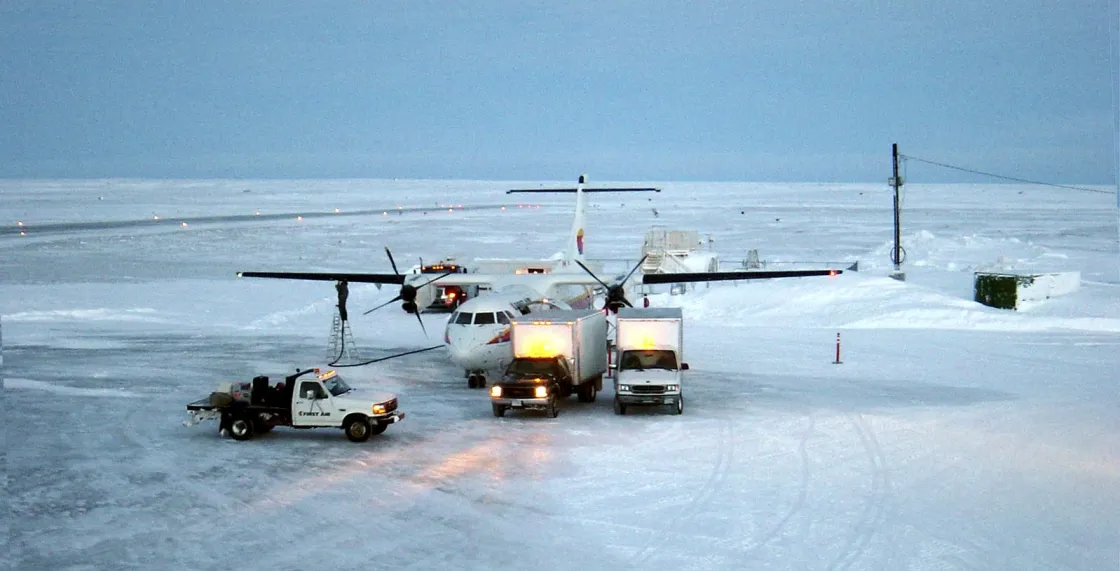 Photo of plane unloading on icy pavement Photo of plane unloading on icy pavement