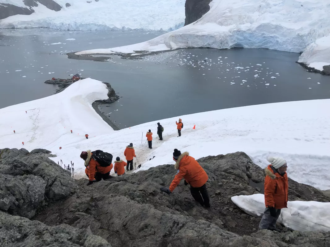 Researchers walk toward the sea in Antarctica