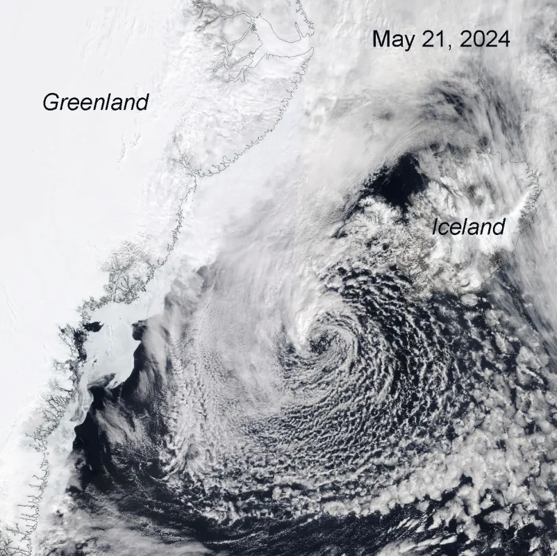 Click to animate. This NASA Moderate Resolution Imaging Spectroradiometer (MODIS) True Color animation flickers between May 20, 2024, and May 21, 2024, to show the progression of the polar low. Greenland is on its left; Iceland is to its right.