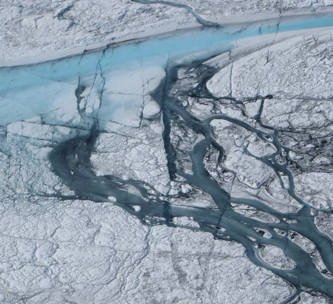 Photograph of meltwater streams on the Greenland Ice Sheet during the summer of 2012