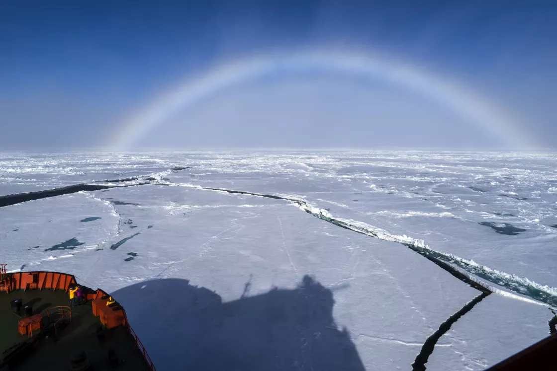 A fog bow forms over sea ice in the Arctic.