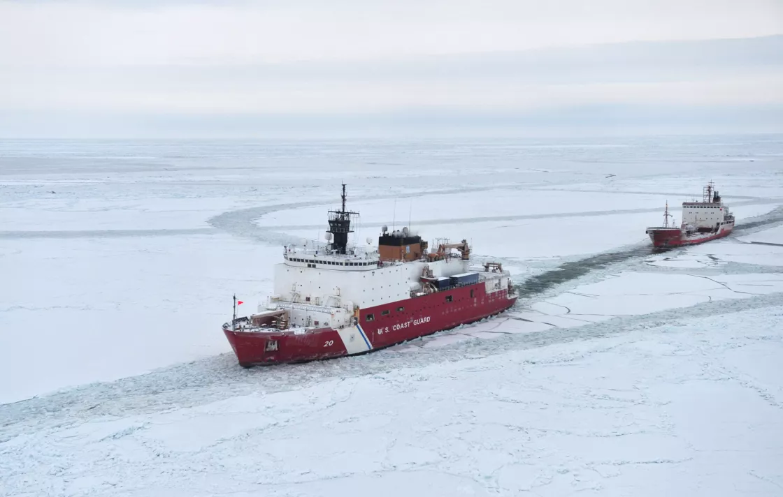 Photograph of U.S. Coast Guard Cutter Healy escorting the Russian tanker Renda through the Arctic ice