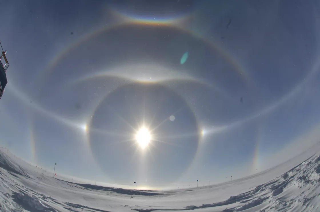 sun dogs appear as bright patches of light around a halo
