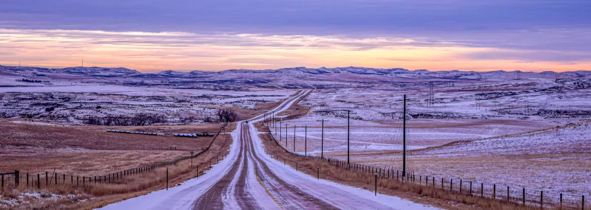 Snow covered road in Wyoming, credit: Unsplash