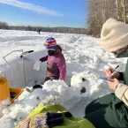 Jesslyn Di Fiori and Devon Dunmire record snow density measurements at Creamer’s Field