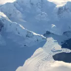 Photo of glacier behind ice shelf in Antarctica