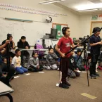students film elders in the classroom