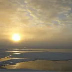 Ice floes spread vastly amid large areas of newly forming ice 