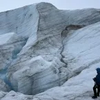 Researcher standing on uneven icy surface